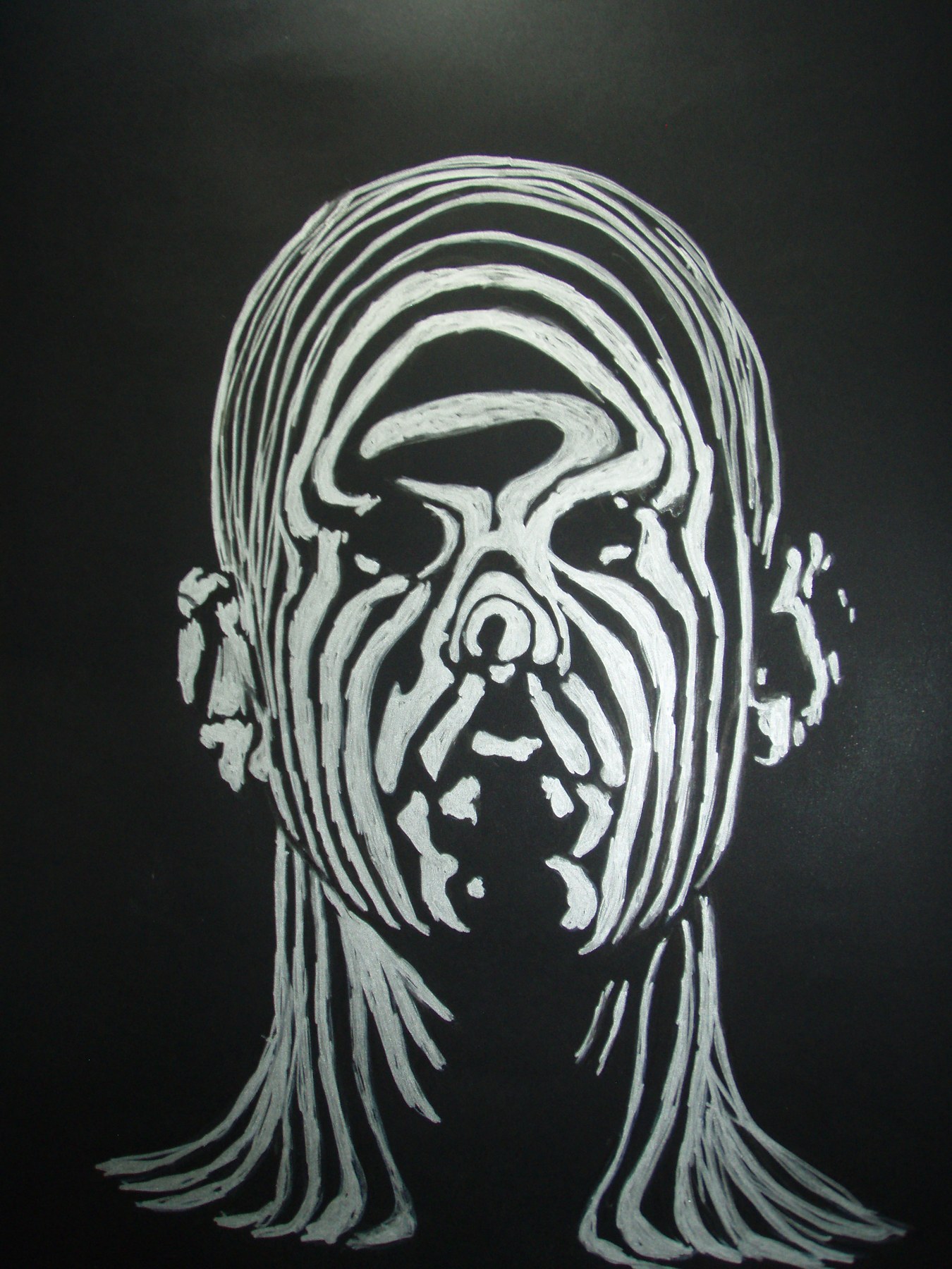 Stylised white face on a black background