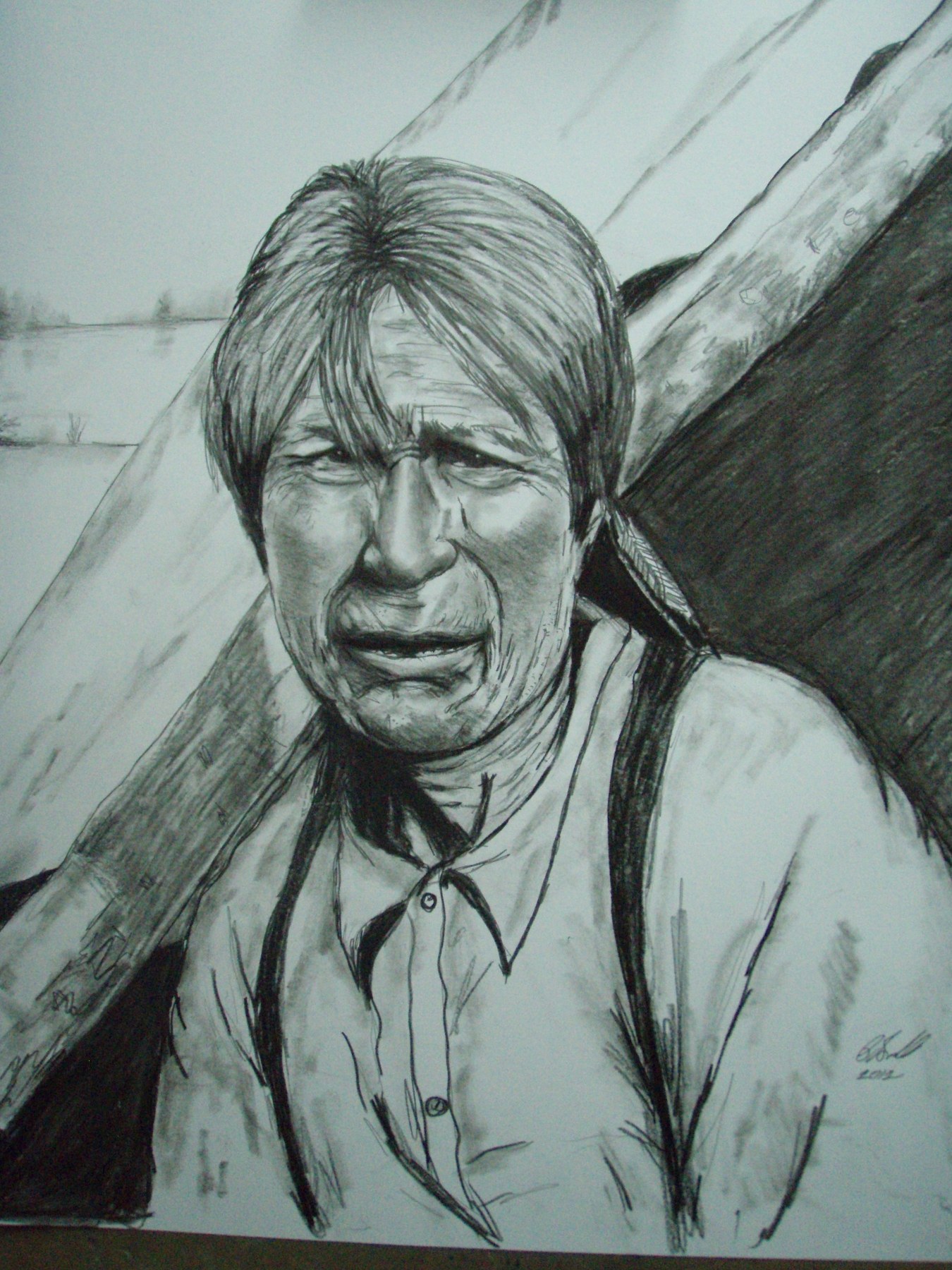 Pencil portrait of a man seated outdoors